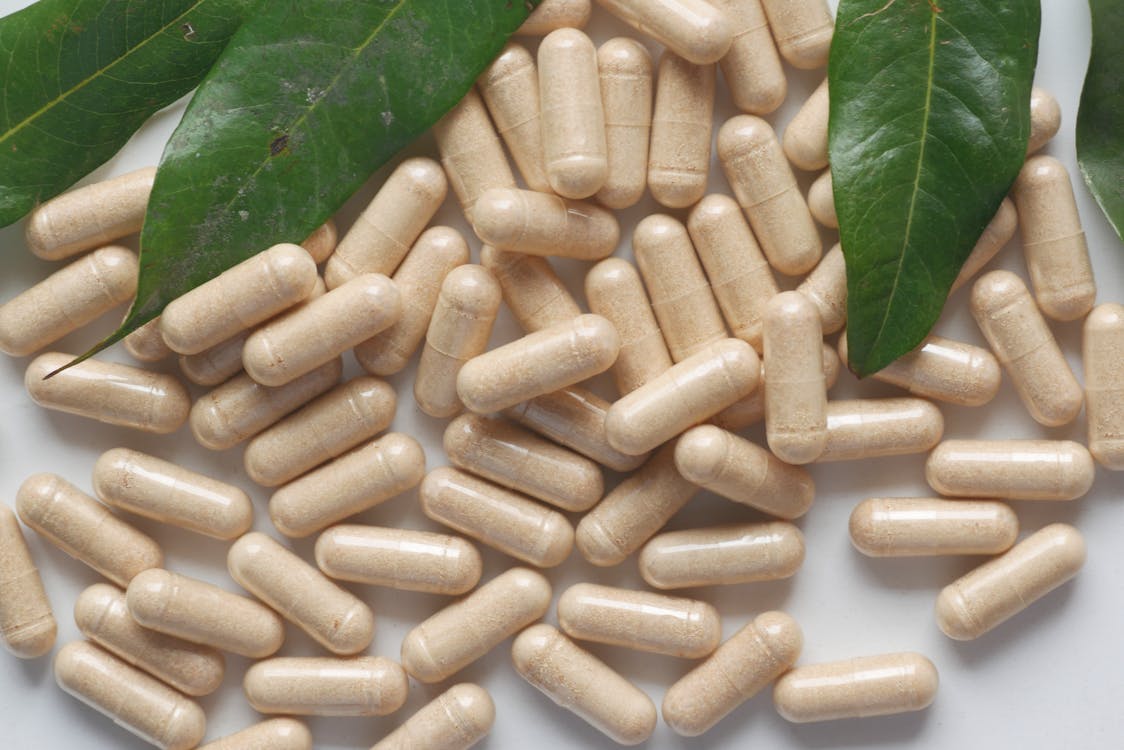 Berberine Australia capsules and supplement bottles on a bench