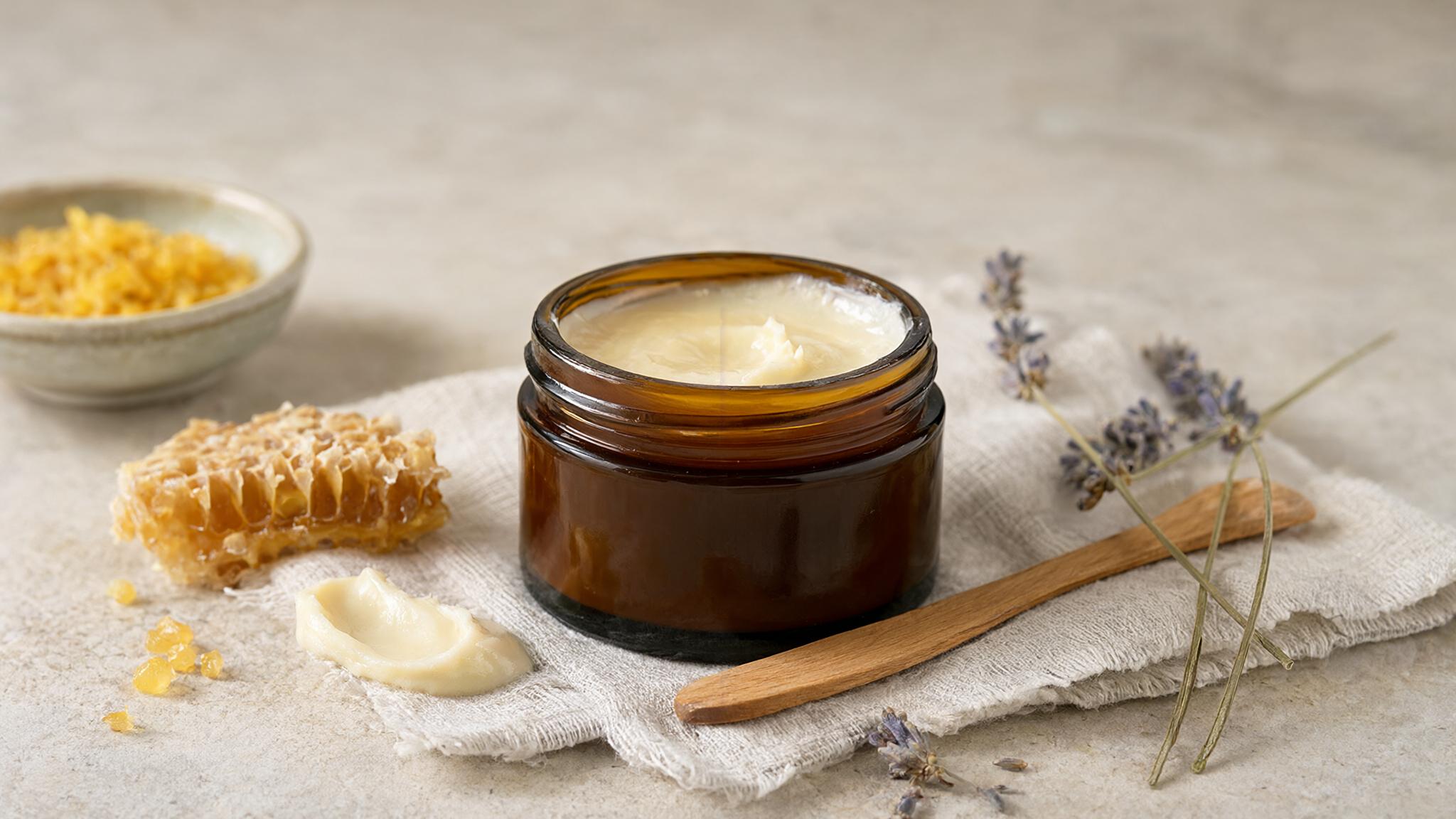 Tallow balm Chemist Warehouse guide: open amber jar of grass-fed tallow balm with honeycomb, beeswax and lavender